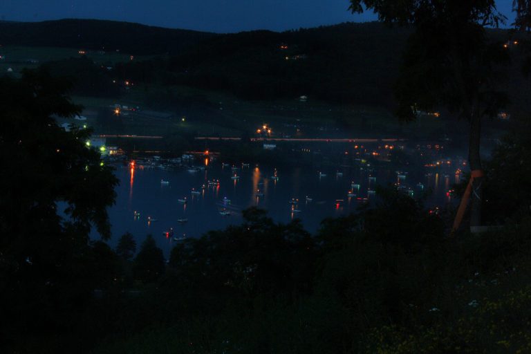 Deep Creek Lake dark night with boats dotting the lakes edge