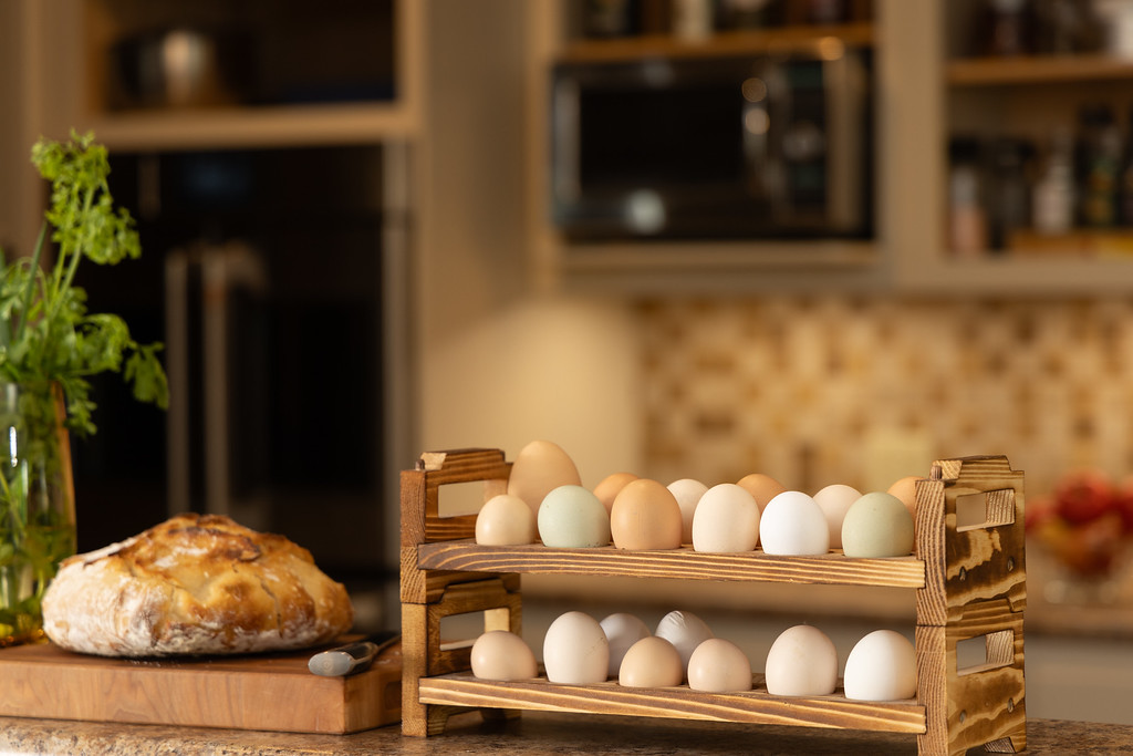 a loaf of bread and different colored eggs