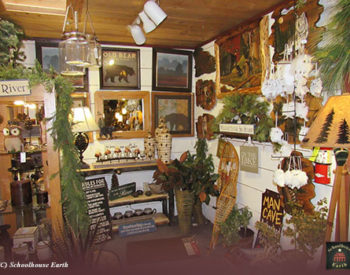Picture of display racks with canned goods, jams, art pieces, and faux plants.
