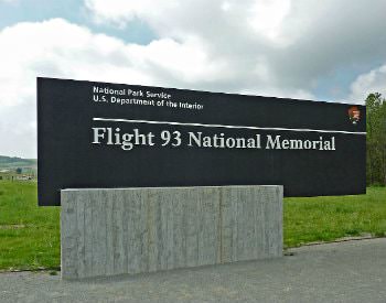 Exterior black sign which says, “National park service, U.S. department of the interior, flight 93 national memorial.”