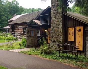 Rustic Blacksmith Shop in artisan Village, with ironwork and ladnscaping